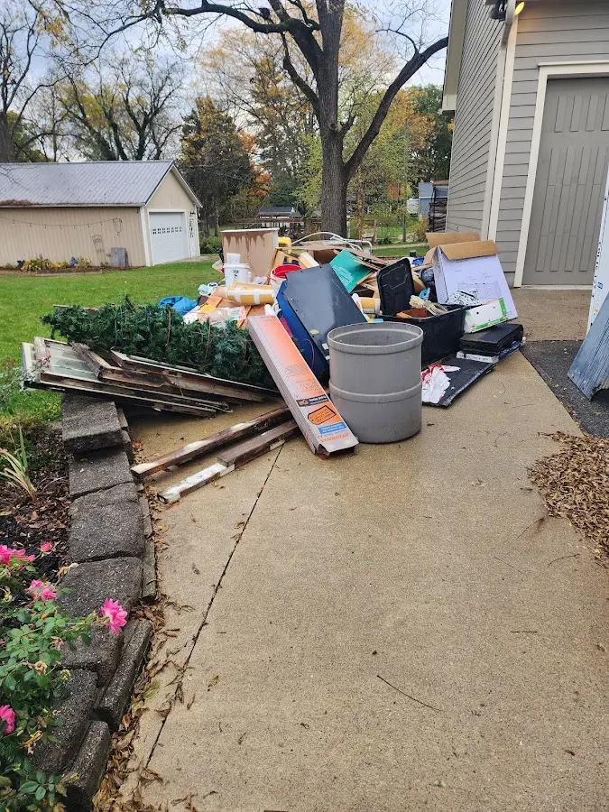 Dumpster being loaded with debris for Residential Dumpster Rental in Central